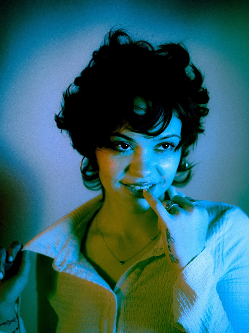 Close-up portrait in blue and amber light